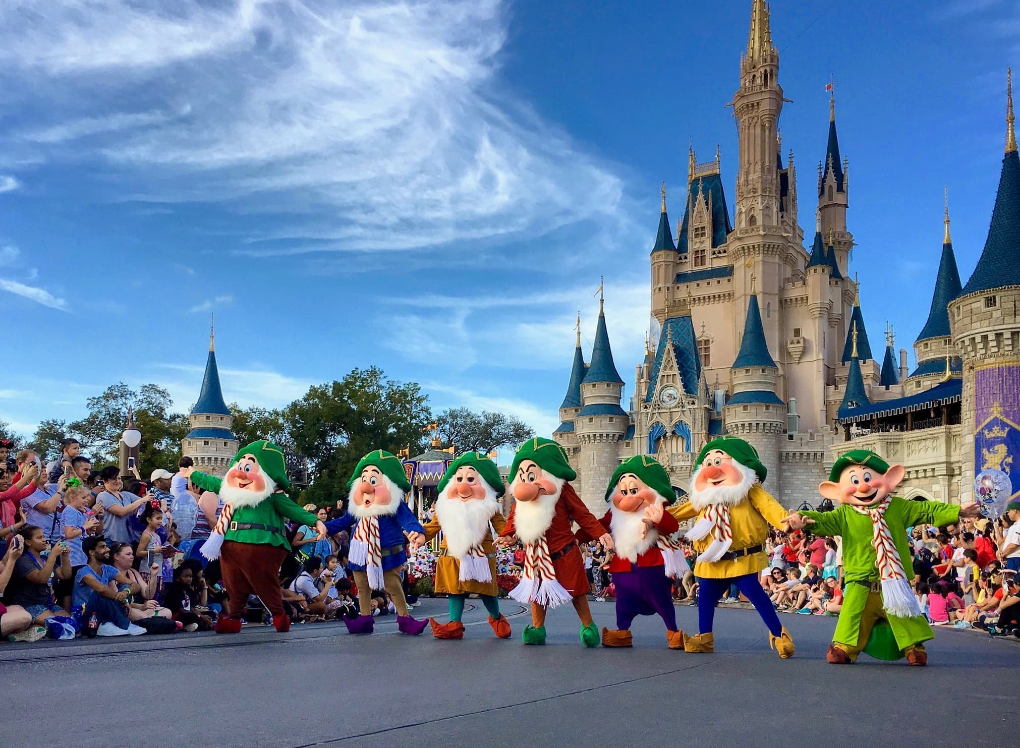 Seven Dwarfs perform with castle in background