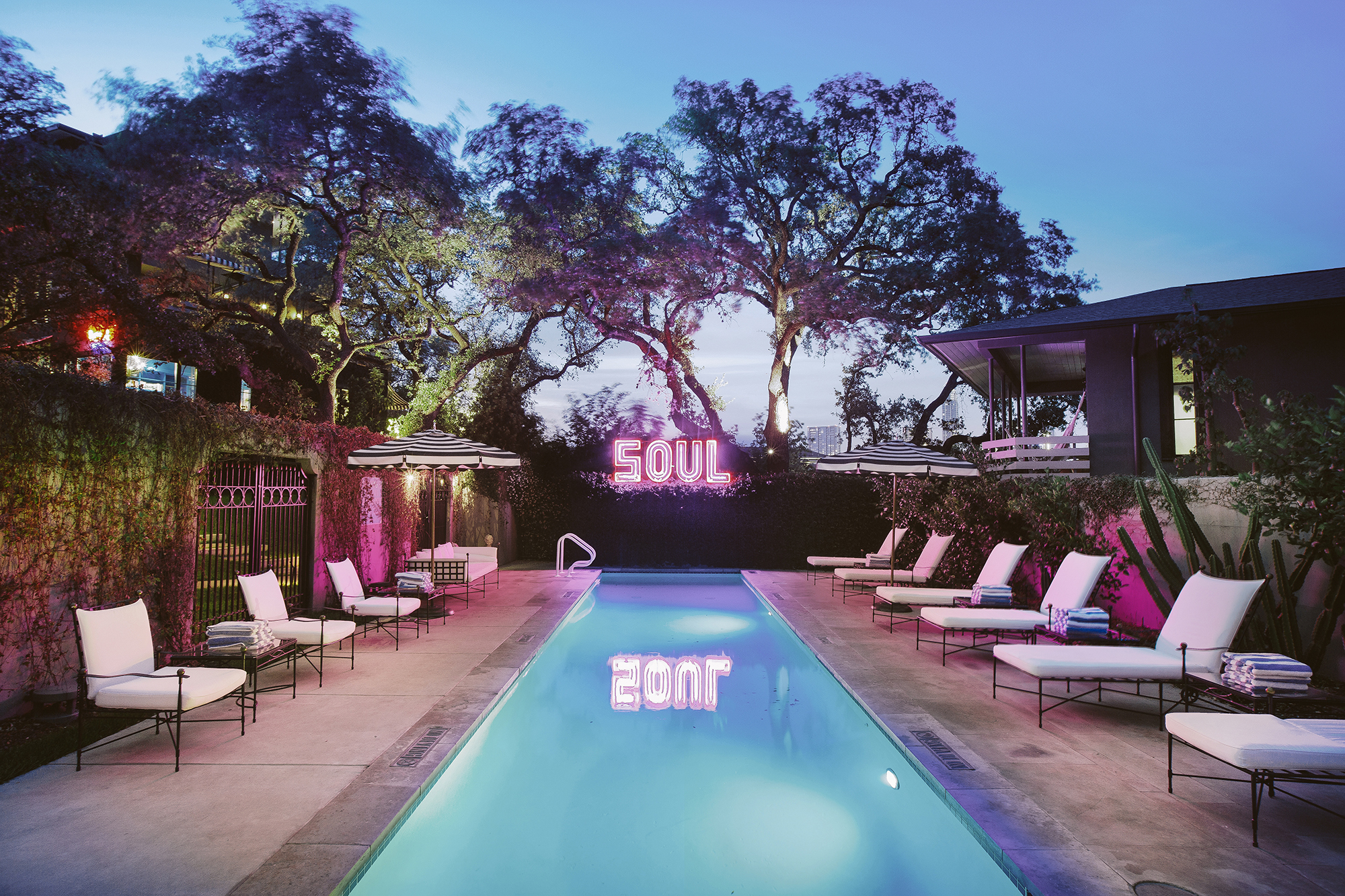pool at dusk with SOUL neon light sign