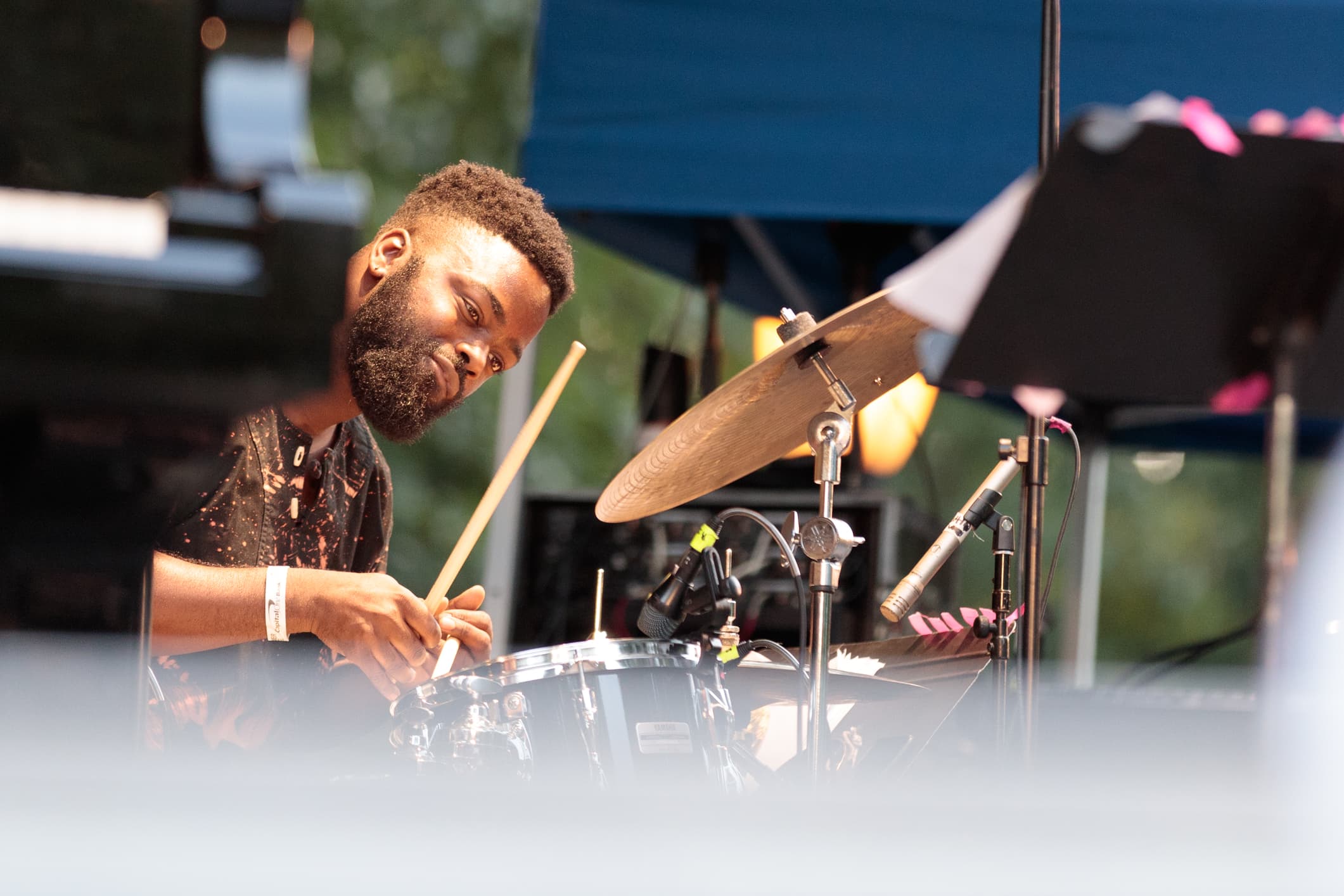 A jazz drummer play9ing at the Charlie Parker Jazz Festival in NYC