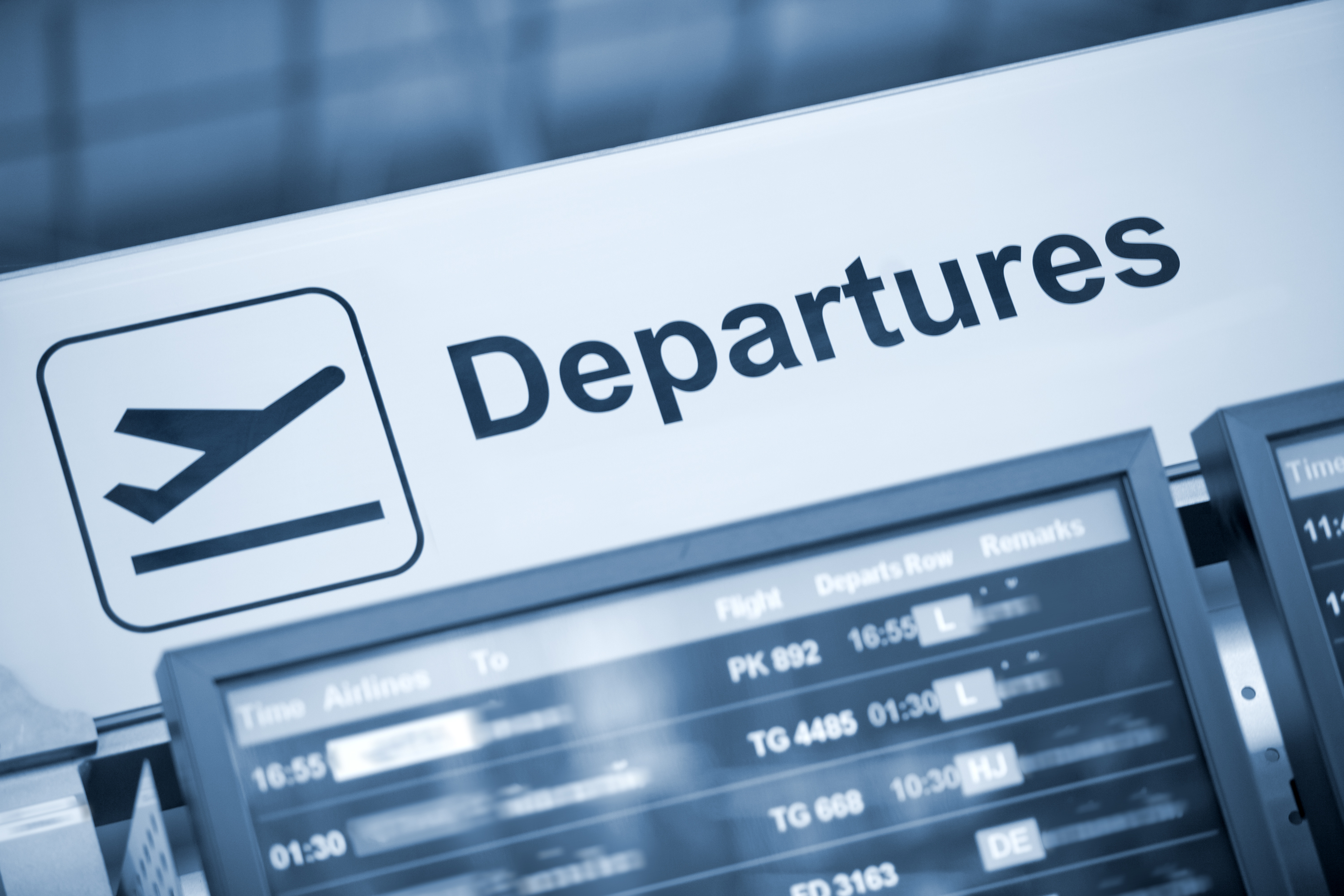 A departures sign in an airport