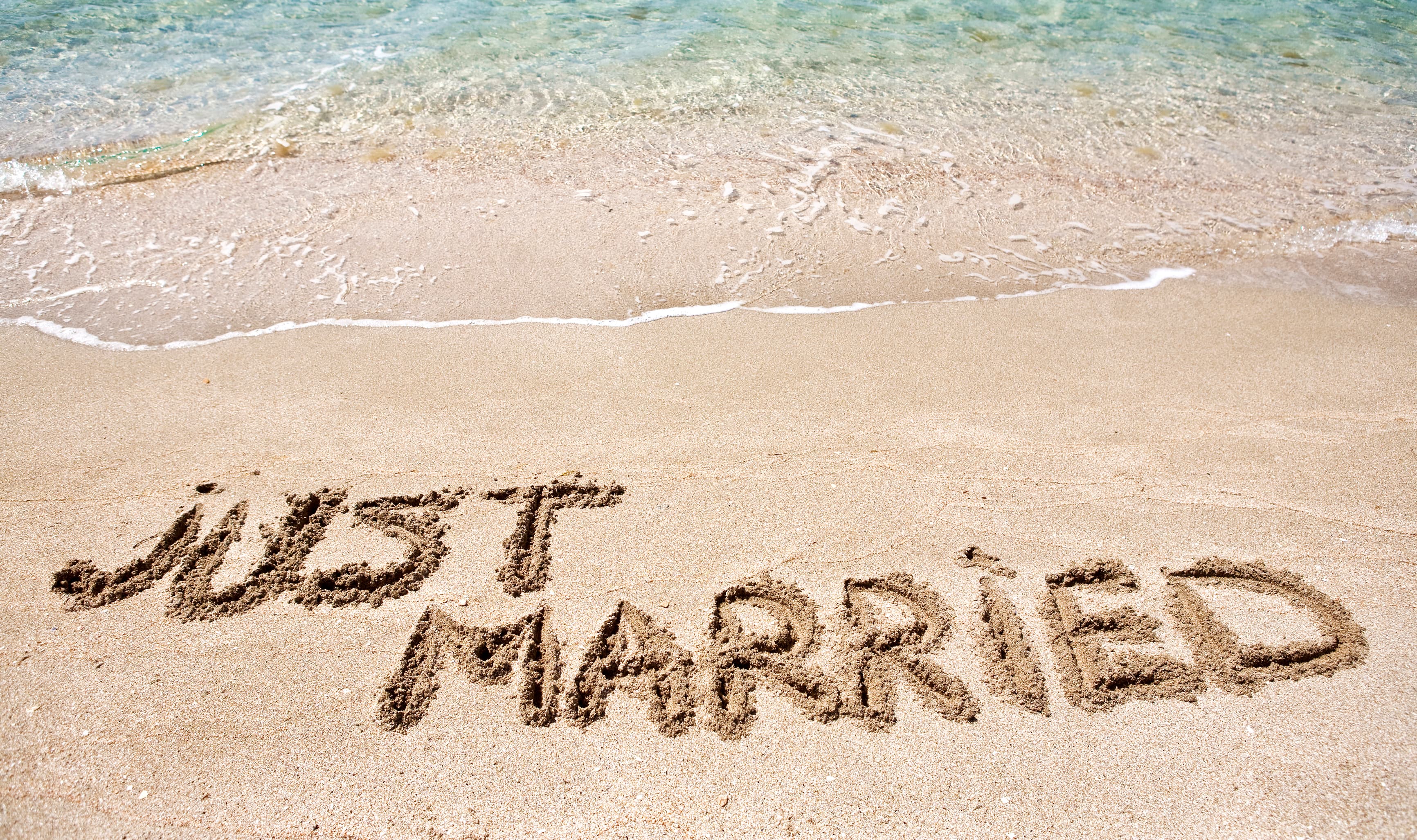 Just Married sign in sand