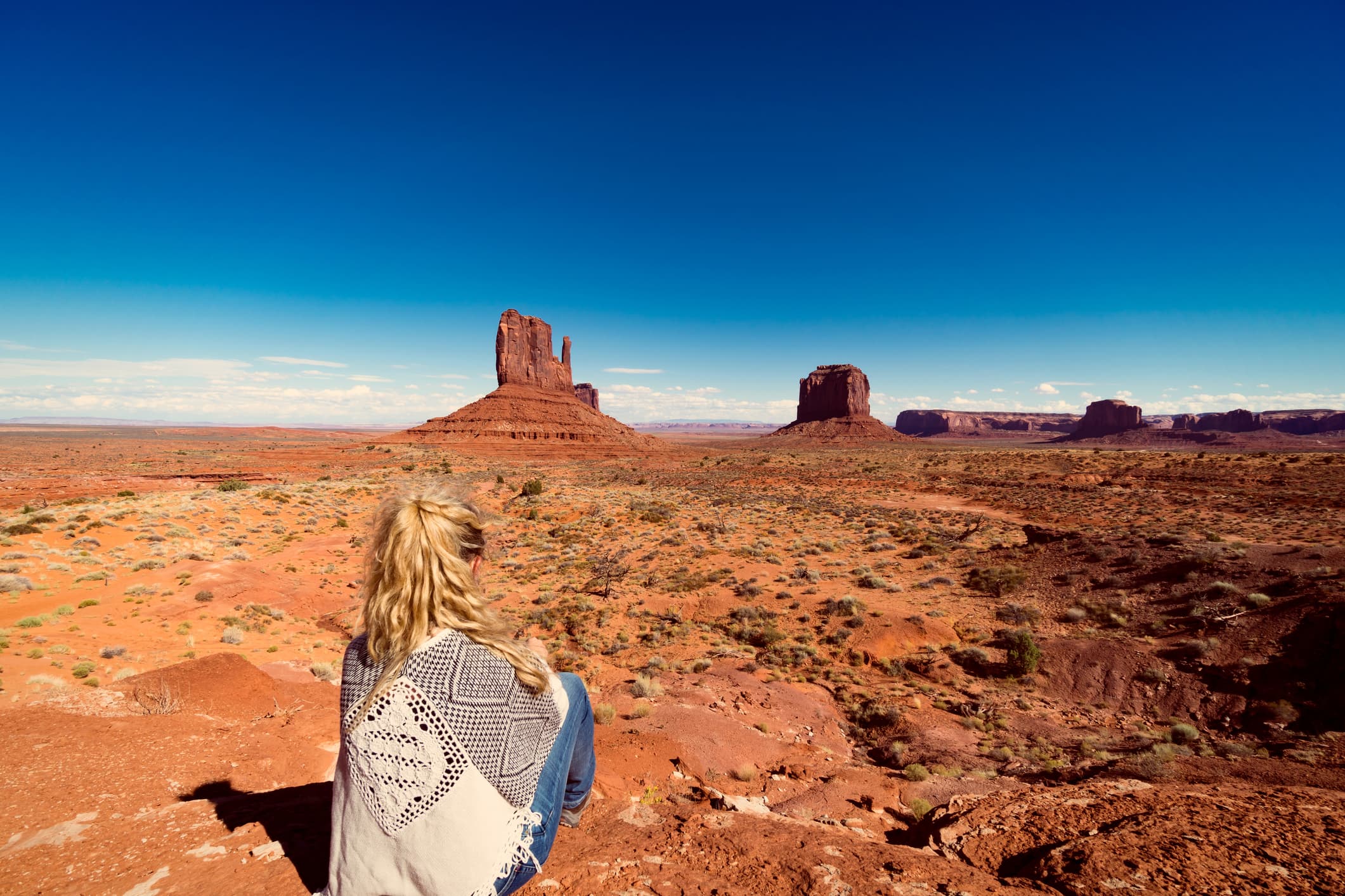 woman alone looking out at monument valley