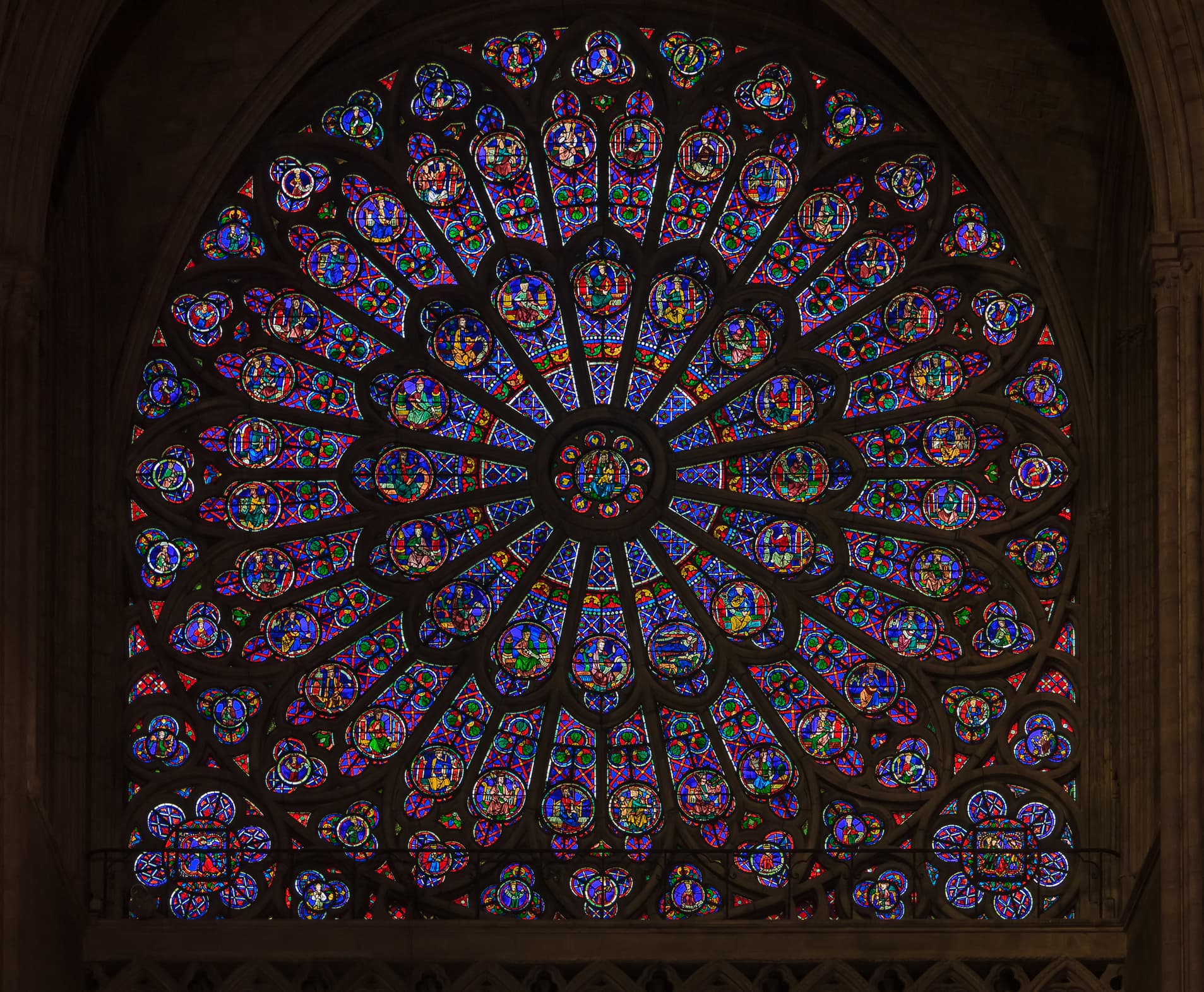 A view of a large stained-glass rose window at the Cathedral of Notre-Dame, Paris.