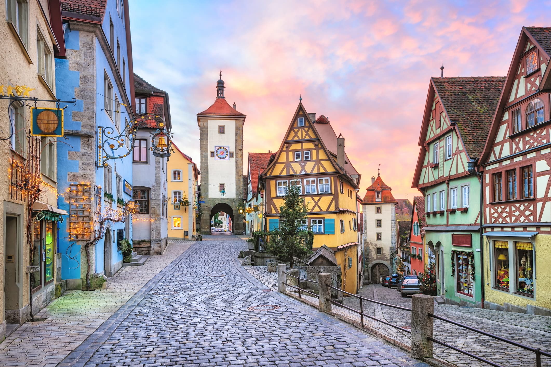 A view of the charming town square of Rothenburg, Bavaria, Germany, with clock tower and medieval buildings.